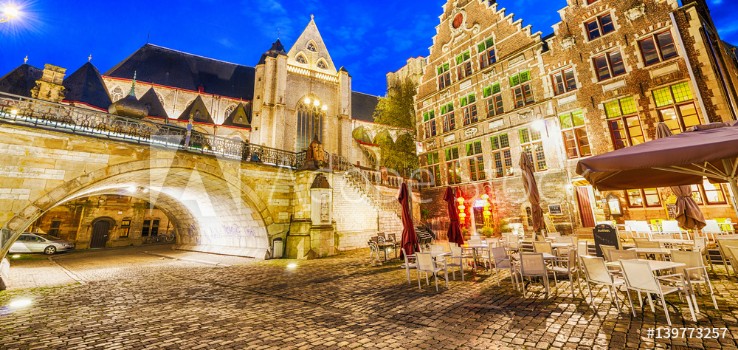 Bild på GENT BELGIUM - MARCH 2015 Tourists visit ancient medieval city at night Gent attracts more than 1 million people annually